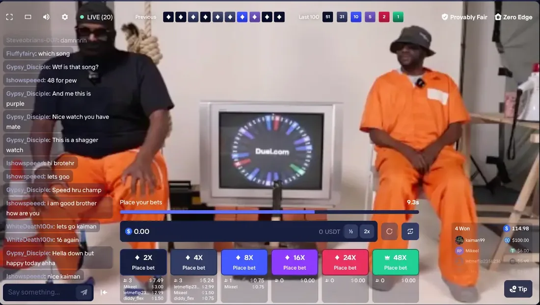 Duel Castle Roulette live-stream wheel branded duel.com between two presenters, with the colour betting board underneath